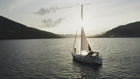 sailing yacht at sunset on a calm bay