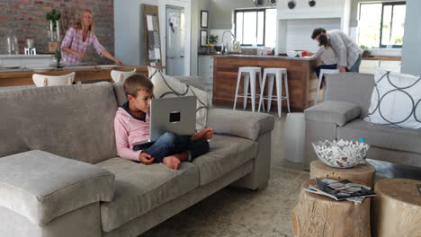 timelapse of father and son playing on laptop computer