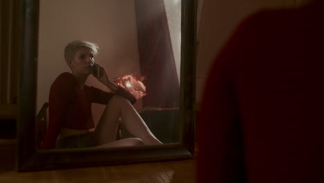 woman on phone call in a bedroom