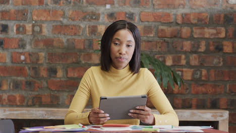 Happy-african-american-casual-businesswoman-having-video-call,-talking-and-using-tablet,-slow-motion