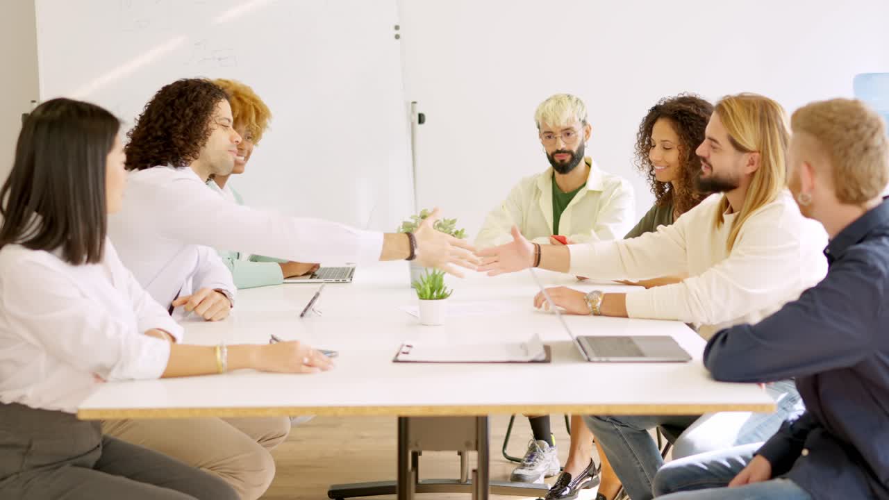 Men shaking hands closing a deal in a meeting room
