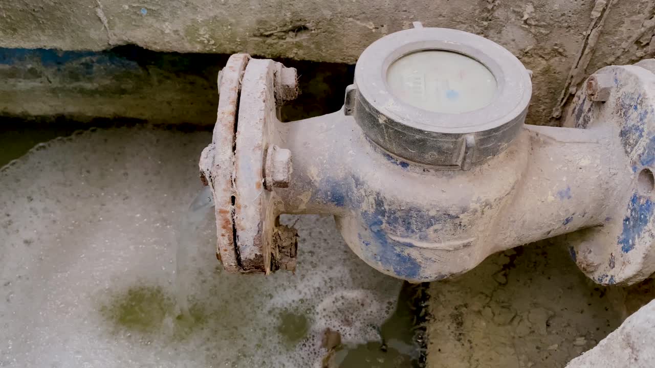 Waste chemical water coming out from the dirty water meter pipe Premium ...