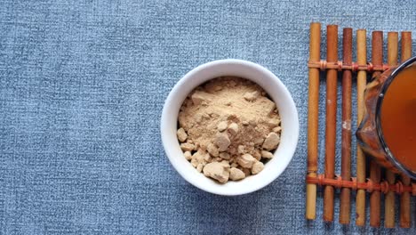 herbal powder and drink on bamboo mat