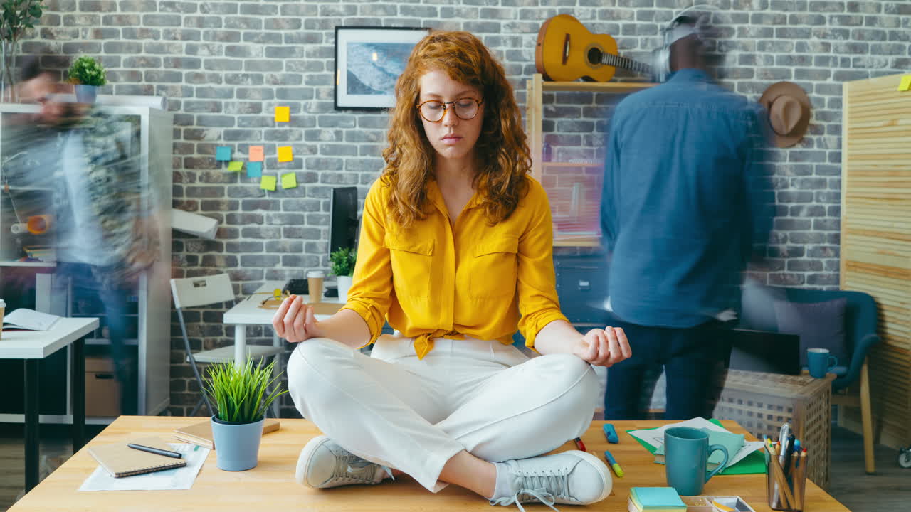 Woman Meditating in a Busy Office