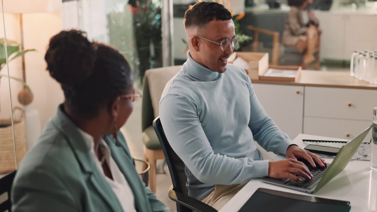 Business Colleagues High-Fiving in Office