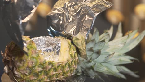 hookah bowl covered in pineapple sail boat