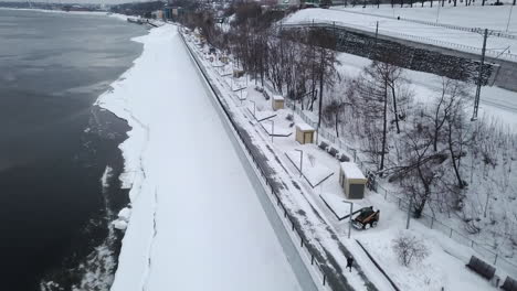 snowy city riverfront park with snow removal