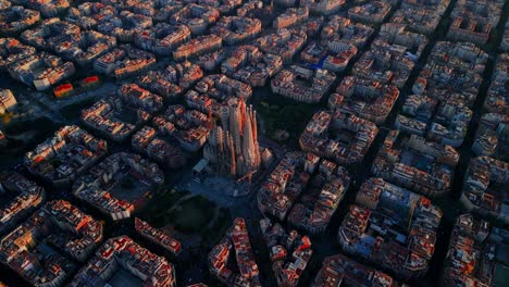 aerial pass over eixample grid layout in barcelona during golden hour, city detail in warm light