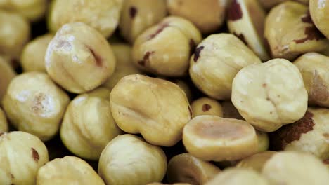 peeled hazelnuts on a rotating plate (seamless loopable)