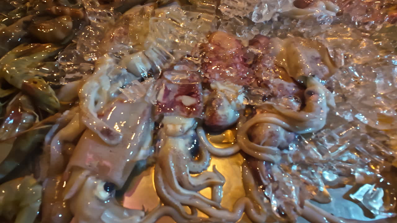 Fresh fish seafood squid carp prawns ocean restaurant over ice Indonesia Bali Southeast Asia