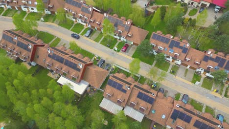 Looking-down,-panel-rooftop-one-the-leading-renewable,-solar-panels-energy-Efficiency-neighborhood-suburb-is-covered-in-rooftop-solar-energy