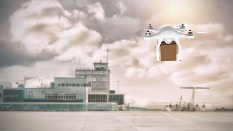 drone llevando una caja en un aeropuerto