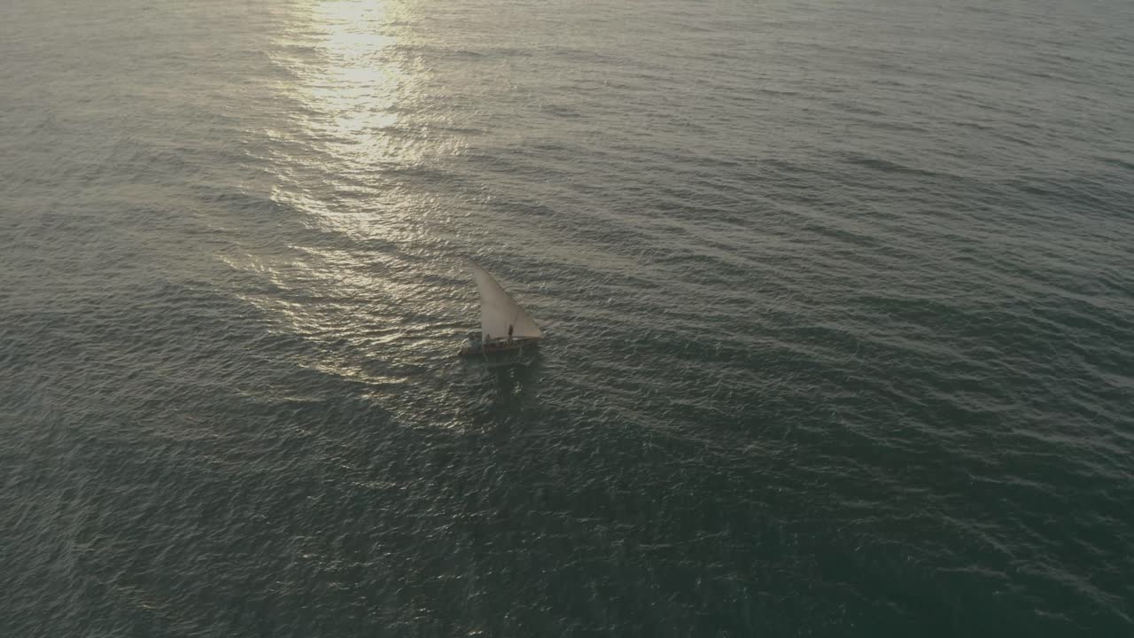 Drone shot of a Fishing boat sailing in the Indian Ocean off the coast of Kenya, Msambweni