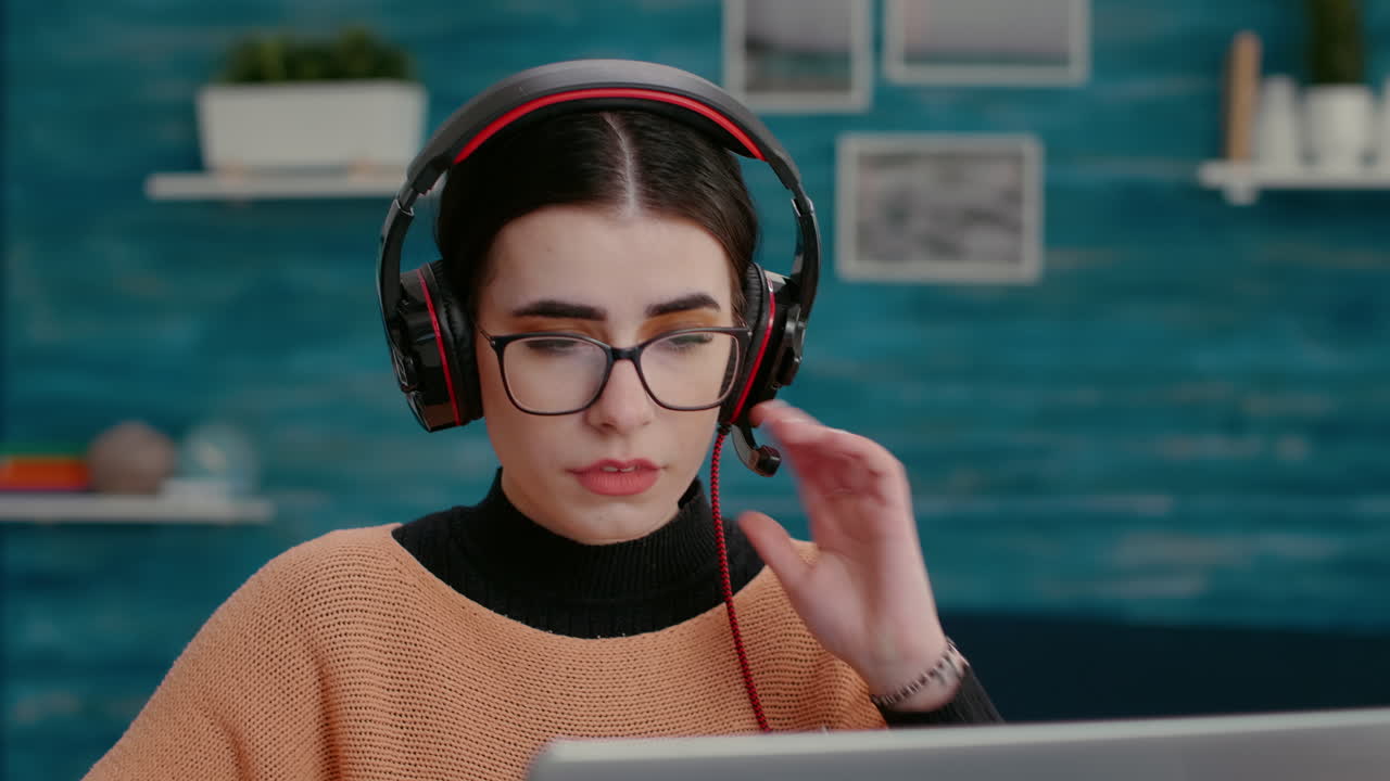 Female person wearing headset at online videoconference call