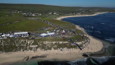 Aerial-orbiting-shot-of-Surf-league-competition-Margaret-River-PRO-2023-in-Australia