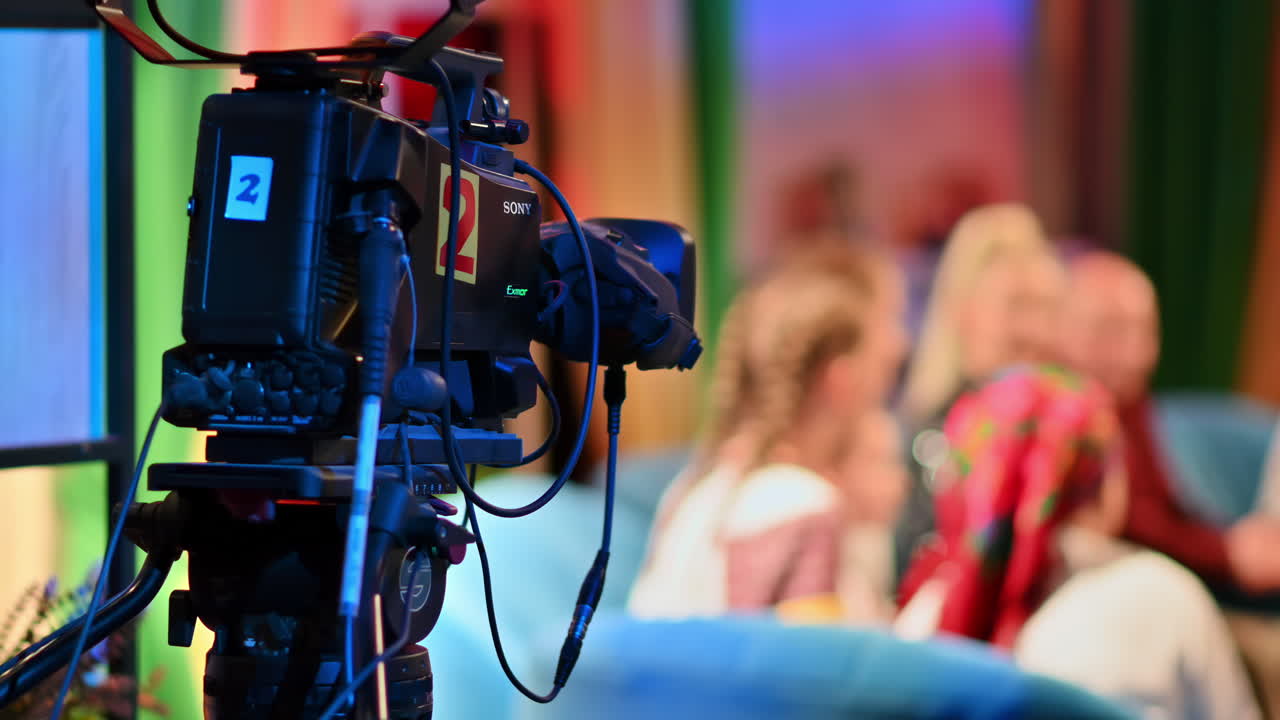 Professional television camera shooting a talk show in a studio. Video production backstage