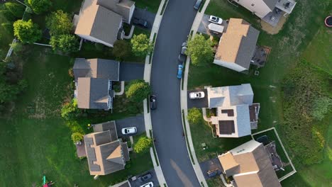 single family homes with solar panels on street at sunset time