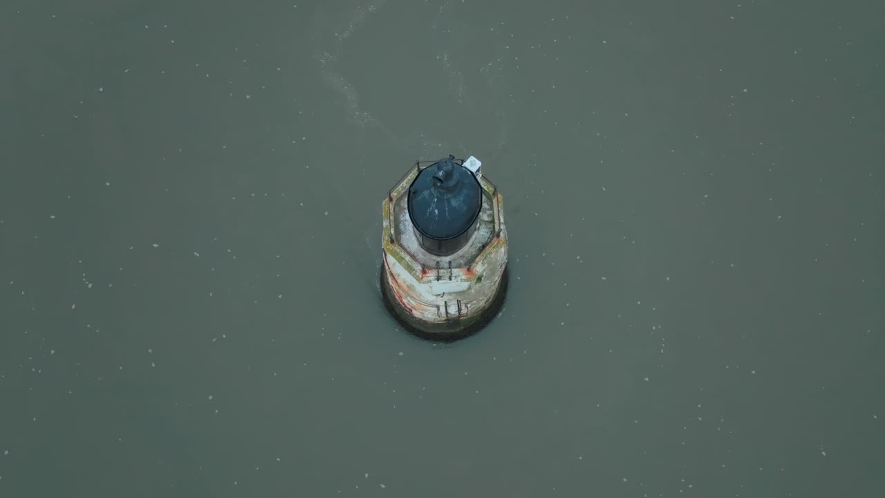 Old Abandoned Rusting Derelict Lighthouse In Calm Murky Water. Top Down Static View. Plover Scar Lighthouse, Lancashire, UK