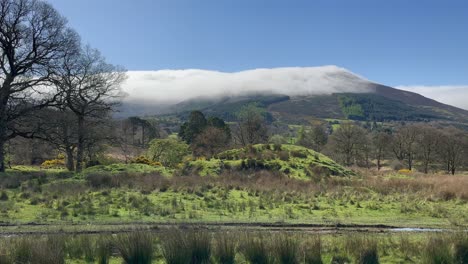 shades of lush green landscape: keadeen mountain cloud in ireland