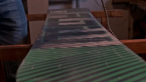 home made waxing of a green snowboard