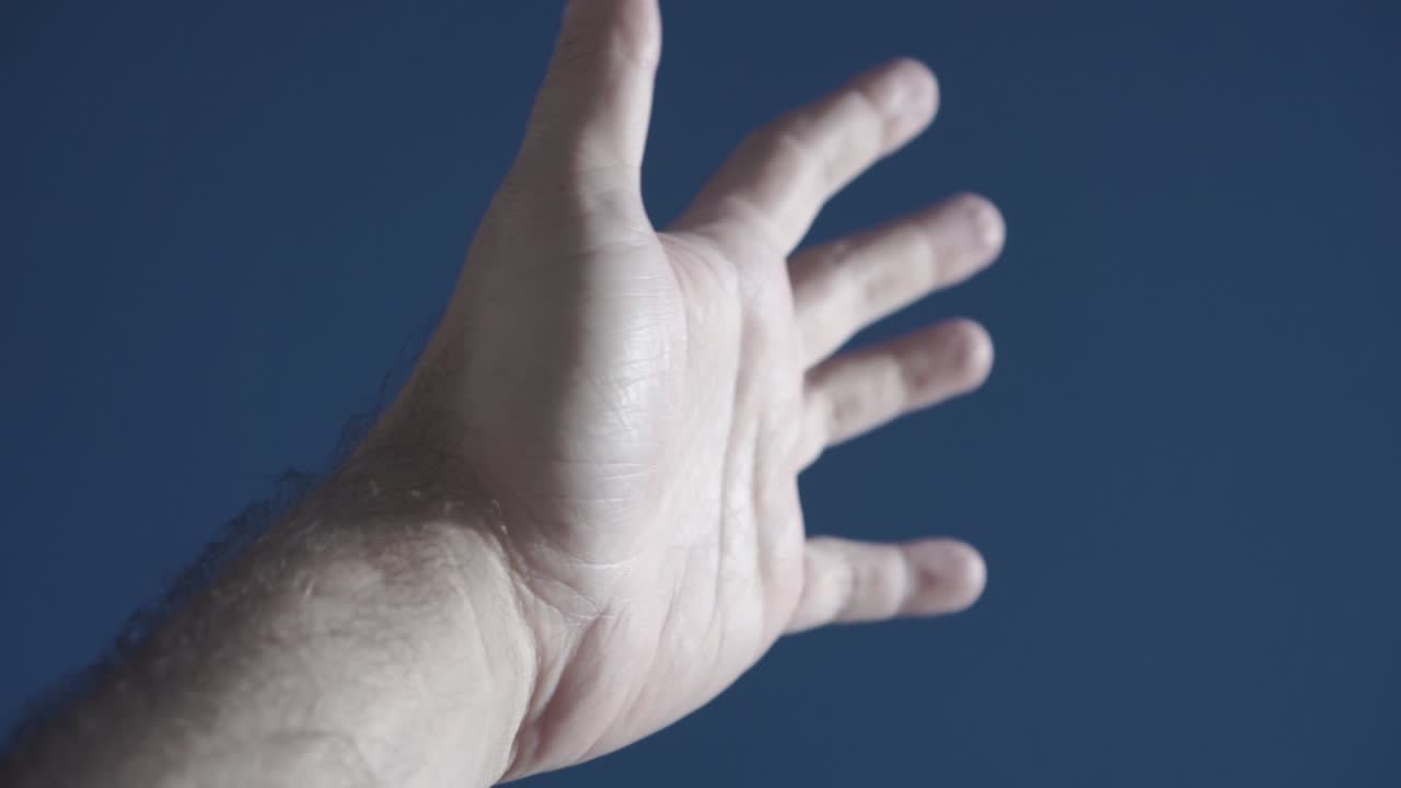 Slowly rotating left hand as the sun warms the skin, feeling a wind through fingers, touch the blue sky