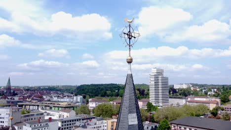 golden rooster and cross on church spire in kaiserslautern city