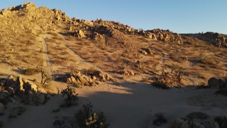 Aerial-footage-panning-up-on-deserted-rocky-Hill