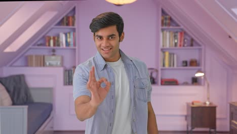 happy indian boy showing okay sign