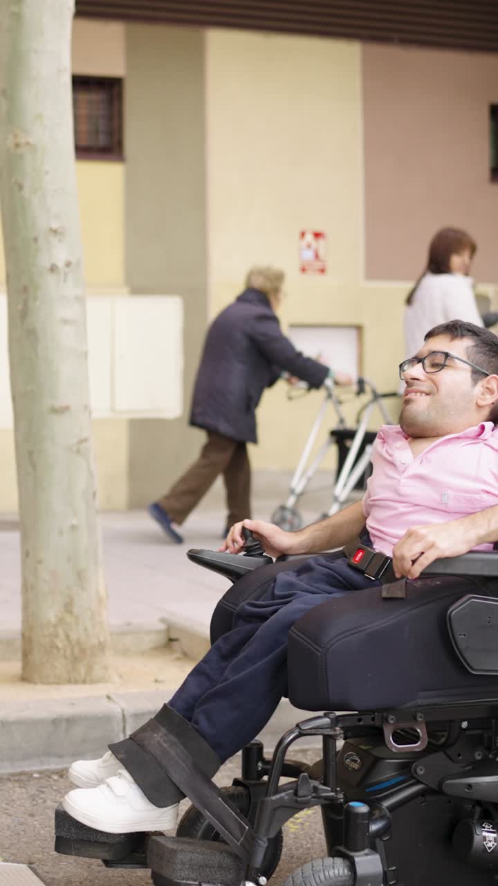 Man in Wheelchair with Caregiver Outdoors