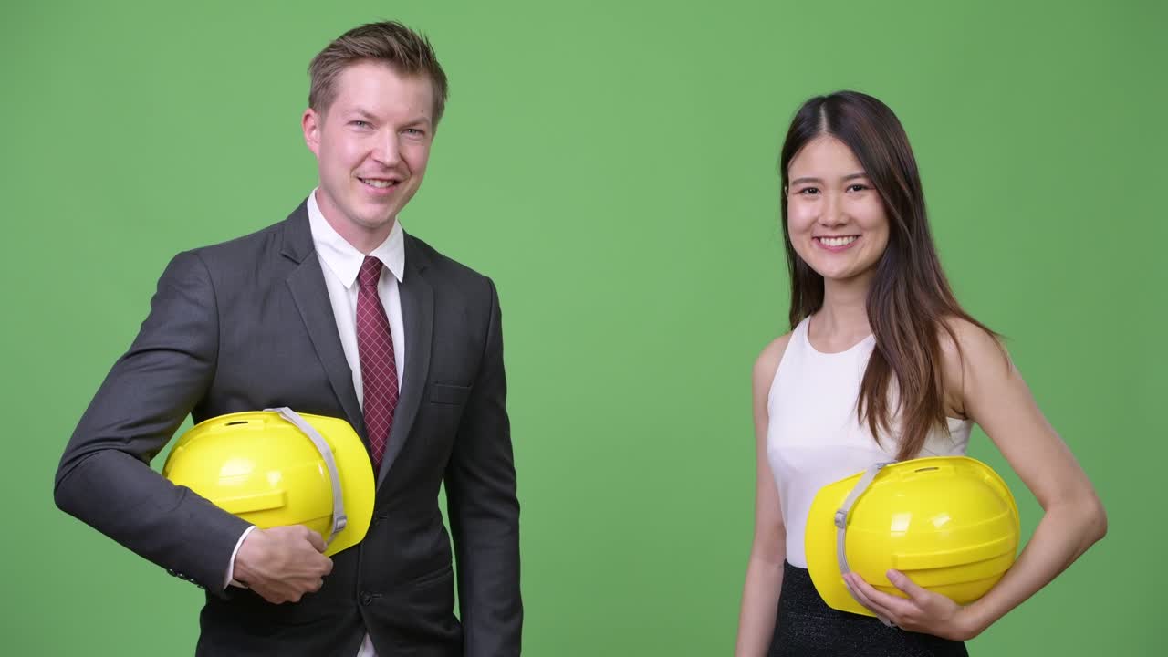 Multi-ethnic business couple as engineers together