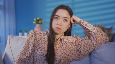 frustrated asian woman suffering from depression worries about wrong decision.