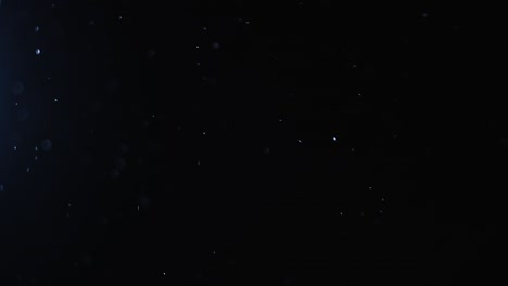 fondo negro de 4k de partículas, polvo y humo en movimiento