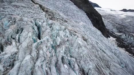 travelling of a hangig glacier in the swiss alps in a cloudy day