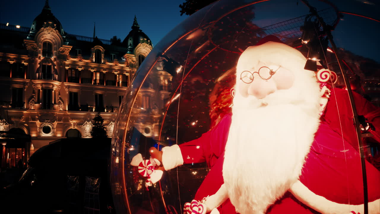 Big Santa Claus decoration in the courtyard of the Monte Carlo Casino in the evening