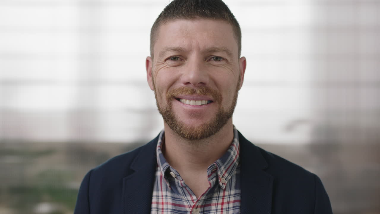 close up portrait of professional businessman smiling confident at camera enjoying executive lifestyle