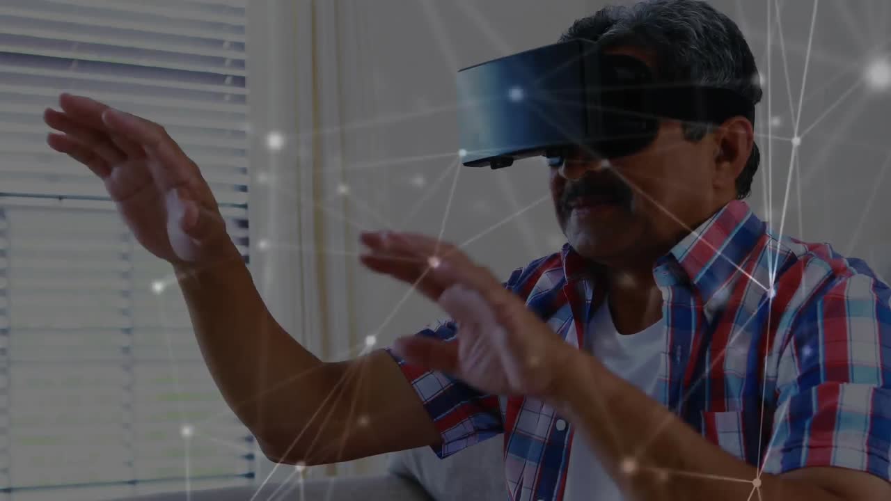 Man wearing a virtual reality headset moving his arms