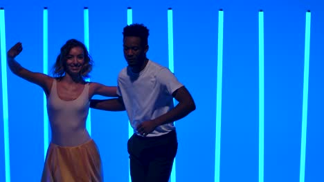 couple dancing in neon blue light