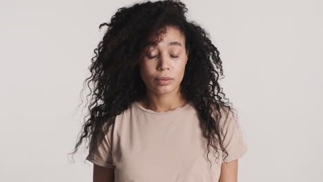 african american worried woman over white background.