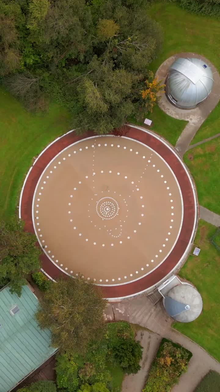 Rising overhead social ratio 60FPS aerial of the groudns at Armagh Planetarium in County Armagh, Northern Ireland. Produced in 1080x1920 with broadcast ready Rec709 color