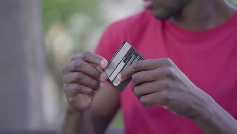 Closeup-of-male-hands-typing-on-laptop,-paying-with-credit-card