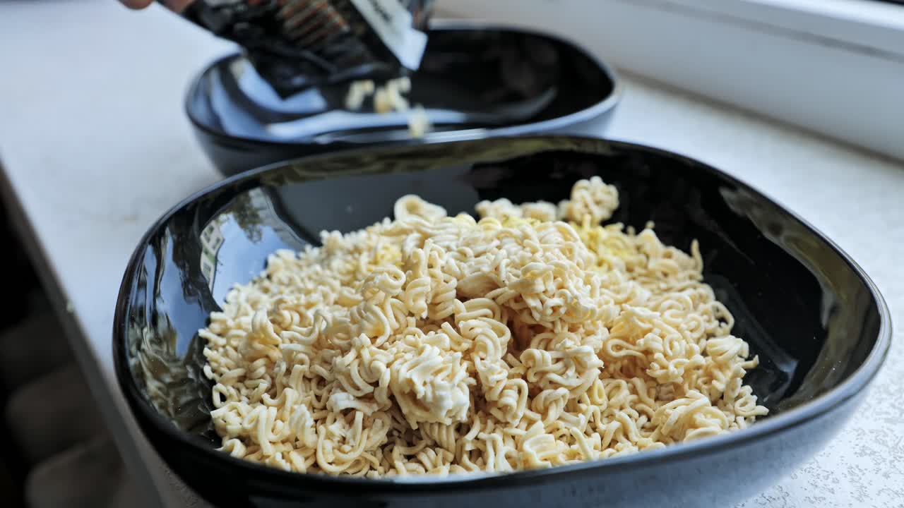 Food close up of instant noodles in bowls with packet poured into background