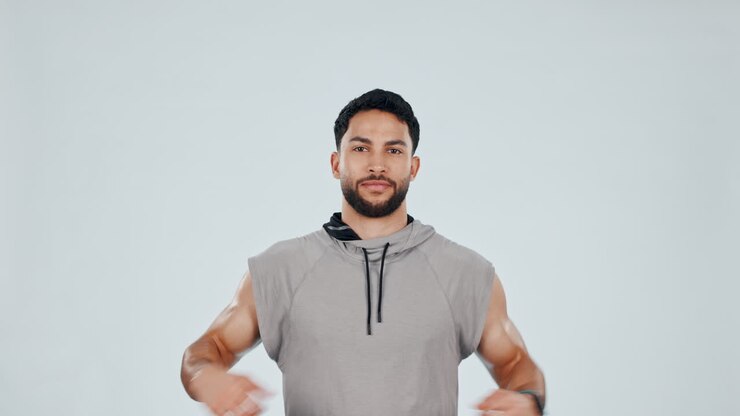 Fitness, stretching and face of man in studio