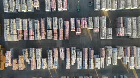 bird's eye view of boxes of tiles piled outdoor in a tile factory