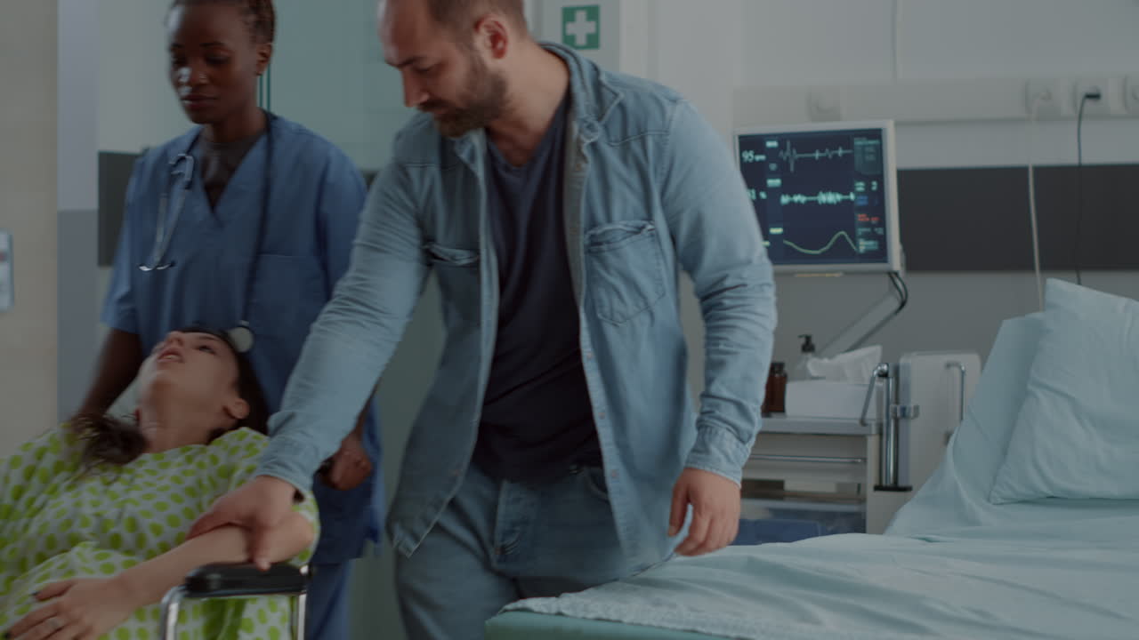 Nurse of african american ethnicity helping pregnant patient