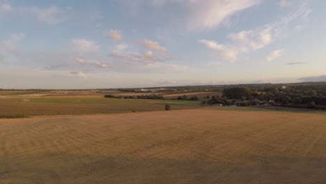 Slowly-ascending-up-to-reveal-rolling-harvested-fields-and-farm-land