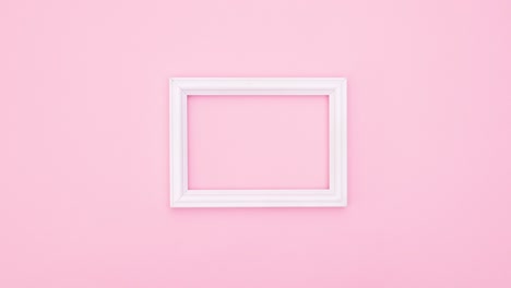 pastel make up products appear around white frame for text on pink theme. stop motion