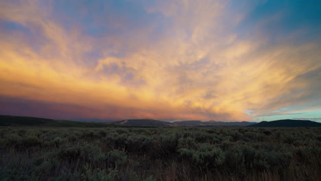 vibrant sunset over a mountain landscape with expansive field