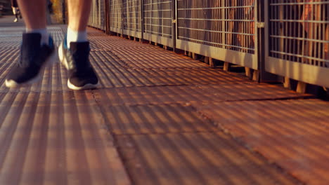 man running on bridge