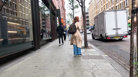 people walking on a bustling city street