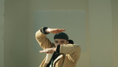 Street-Dancer-Performing-Arm-Moves-and-Looking-at-Camera